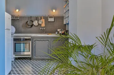 a kitchen with a sink and a stove at Maison Bianchi - 24 Paul Deroulede in Nice