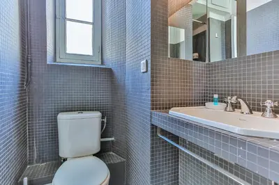 a bathroom with a toilet and a sink at Maison Bianchi - 24 Paul Deroulede in Nice