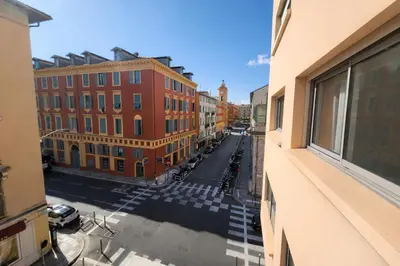 a view of a street in a city with buildings at Port, vue mer et confort et parking in Nice