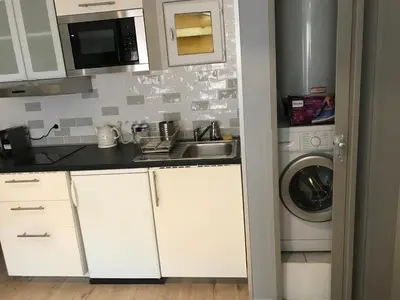 a kitchen with a sink and a washing machine at STUDIO VIEILLE VILLE in Nice