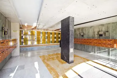 a lobby with a column in the middle of a building at PROMENADE HOLIDAY - PALATIN PROMENADE in Nice