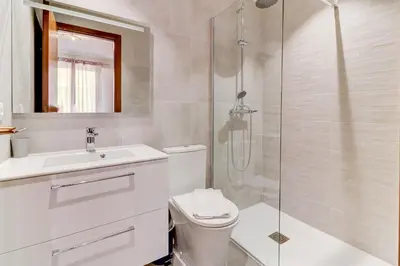 a bathroom with a toilet and a sink and a shower at PROMENADE HOLIDAY - PALATIN PROMENADE in Nice
