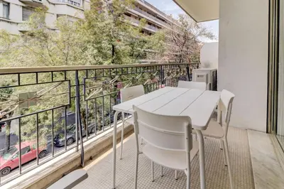 a balcony with a table and chairs and a view at PROMENADE HOLIDAY - PALATIN PROMENADE in Nice