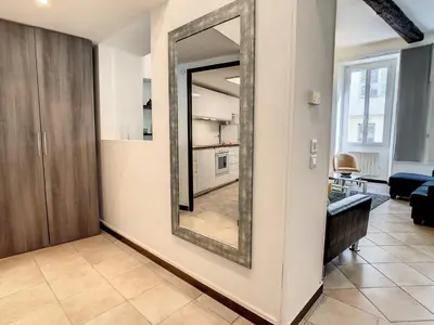 a mirror on a wall in a living room at Nestor&Jeeves - ZEN - Central - Very close beaches in Nice