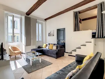 a living room with a couch and a staircase at Nestor&Jeeves - ZEN - Central - Very close beaches in Nice