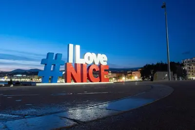 a sign that says i love neice on the side of a street at Goldstar Apartments & Suites in Nice