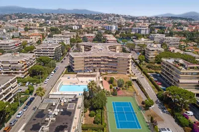 an aerial view of a city with a tennis court at Résidence Pierre & Vacances Heliotel Marine in Saint-Laurent-du-Var