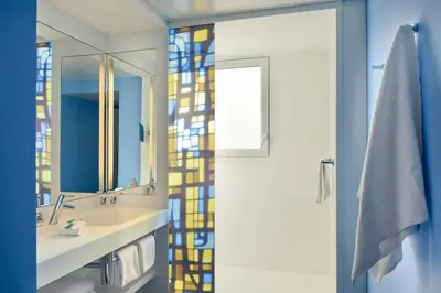 a bathroom with a sink and a mirror at Nice Centre Hotel in Nice