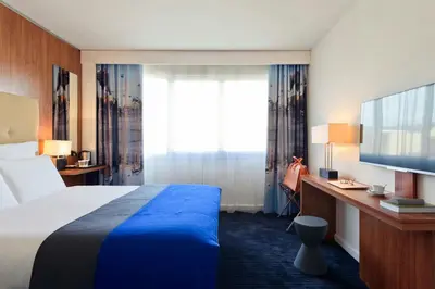 a hotel room with a bed and a large window at Nice Centre Hotel in Nice