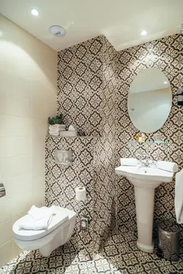 a bathroom with a sink and a mirror at Villa Otero by Happyculture in Nice