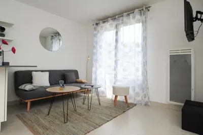 a living room with a couch and a table at Mini suite Othello - Five Stars Holiday House in Nice