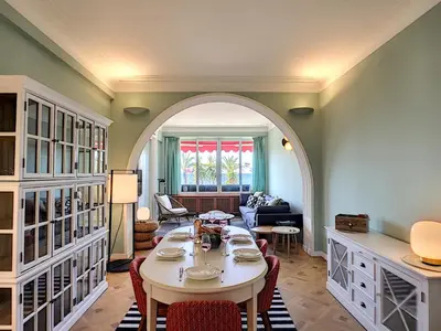 a living room with a table and an archway at Nestor&Jeeves - LAGOON PROMENADE - Central - Sea front in Nice