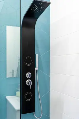 a shower with a black shower head in a bathroom at 1 CASSINI - Magnifique 2 pièces place Garibaldi - Balcon in Nice