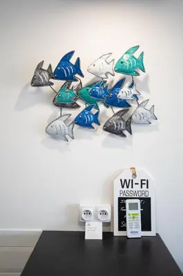 a wall with a bunch of fish on it at STUDIO PROMENADE FLORIDA BEACH in Nice