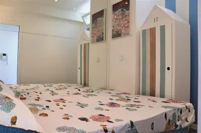 a bedroom with a bed with a bird house on it at 2P NEUF vue Promenade des Anglais / Tram 10min centre in Nice