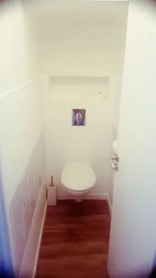a bathroom with a white toilet in a room at 2P NEUF vue Promenade des Anglais / Tram 10min centre in Nice