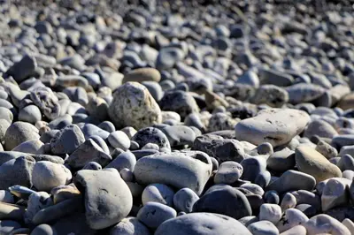 a large group of rocks on a beach at 2P NEUF vue Promenade des Anglais / Tram 10min centre in Nice