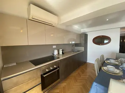 a kitchen and dining room with a table and chairs at PROMENADE HOLIDAY - OLD TOWN PANORAMIC in Nice