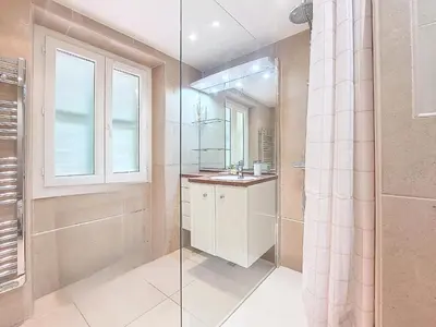 a bathroom with a shower and a sink and a mirror at Nestor&Jeeves - MAISON COURNICHEE - Central - Close sea - Atypical in Nice