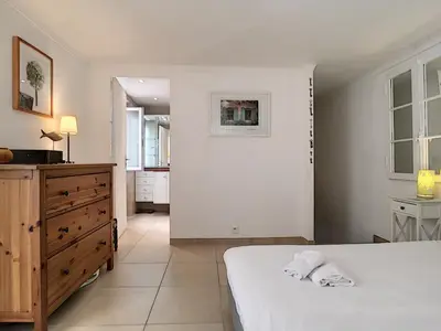 a white bedroom with a bed and a dresser at Nestor&Jeeves - MAISON COURNICHEE - Central - Close sea - Atypical in Nice