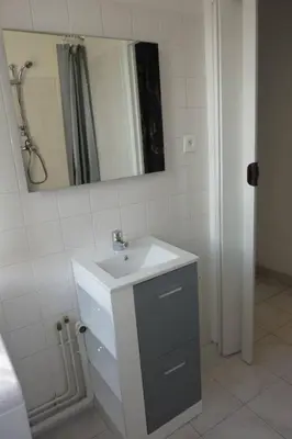 a bathroom with a sink and a mirror at Nice Centre Studio Proche Mer in Nice