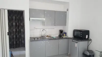 a small kitchen with a sink and a microwave at Nice Centre Studio Proche Mer in Nice