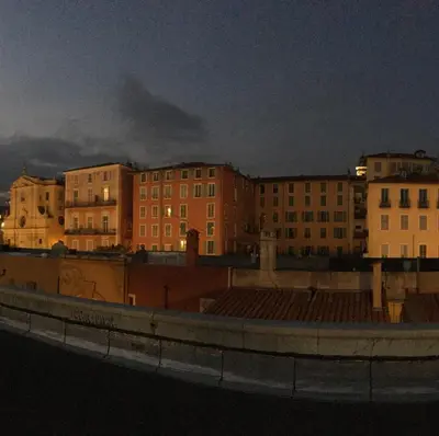 a group of buildings in a city at night at Nice Grand appartement face jardin in Nice