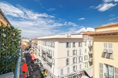 a balcony with a table and two chairs at Massena Street - 1 Bdr Duplex with AC & Parking in Nice