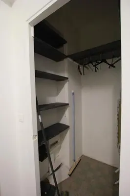 a walk in closet with shelves and a ladder at T2 entièrement équipé, proche toutes commodités in Nice