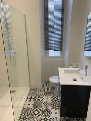 a bathroom with a shower and a sink and a toilet at Gustave in Nice