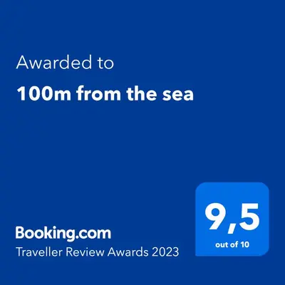 a blue text box with the text awarded to from the sea at 100m from the sea in Nice