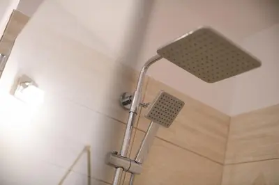 a shower with a shower head in a bathroom at 