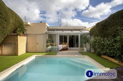 a swimming pool in the backyard of a house at Air-conditioned house with private pool in Cagnes-sur-Mer