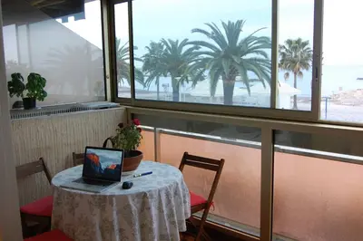 a table with a laptop on top of it in a restaurant at MAEVA in Saint-Laurent-du-Var