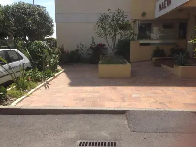 a parking lot in front of a building at MAEVA in Saint-Laurent-du-Var