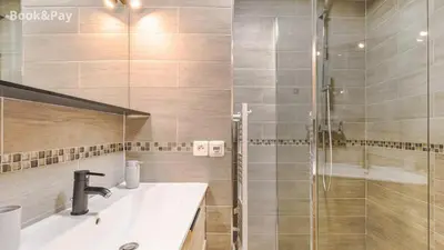 a bathroom with a sink and a shower at La Providence in Nice