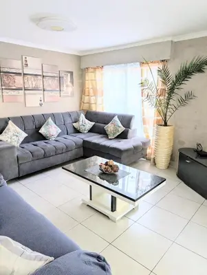 a living room with a couch and a coffee table at La Providence in Nice