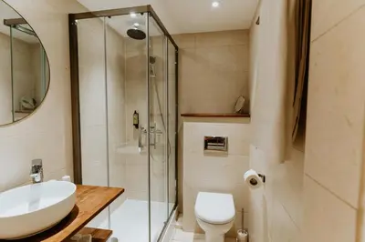a bathroom with a toilet and a sink and a shower at Palm Boutique Hôtel Nice in Nice
