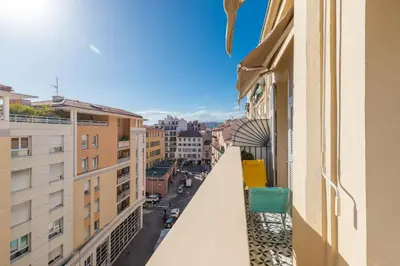 a balcony of a building with a view of a street at Cosy 1 Bdr near Garibaldi Square - Top Floor & AC in Nice