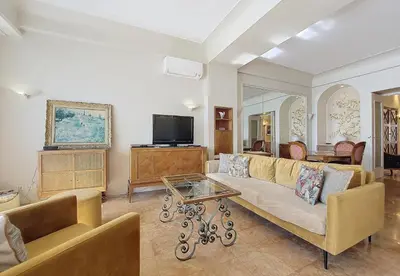 a living room with a couch and a tv at Nestor&Jeeves - HORIZON PROMENADE - Central - Sea front in Nice