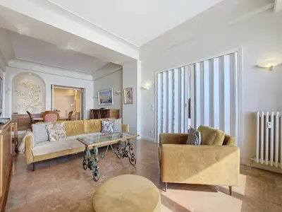 a living room with a couch and a table at Nestor&Jeeves - HORIZON PROMENADE - Central - Sea front in Nice