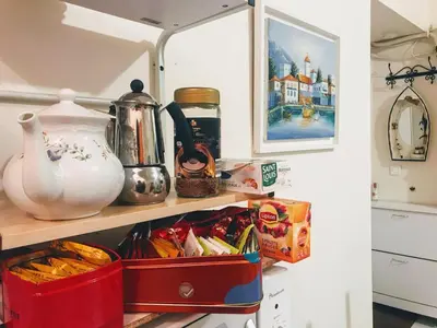 a kitchen pantry with food and snacks on a shelf at Apartment Claudia - Central -Quiet- Near the Sea- AC- Private Parking in Nice