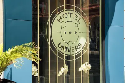 a hello kitty sign on the window of a building at Hôtel Univers in Nice