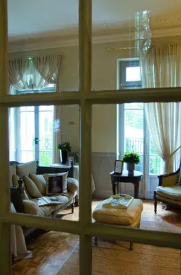 a living room with a view through a window at Hotel Villa Rivoli in Nice