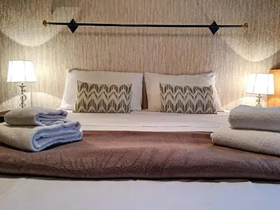 a bedroom with a large bed with two pillows at Nestor&Jeeves - DALPOZZO GRANDE - Central - Close beaches in Nice