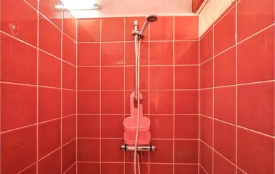 a red tiled bathroom with a shower with a bucket at Amazing Home In Cagnes Sur Mer in Cagnes-sur-Mer