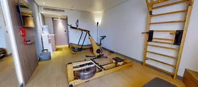 a room with a gym with a treadmill at Radisson Hotel Nice Airport in Nice