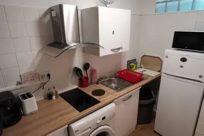 a small kitchen with a sink and a refrigerator at studio centre nice proche de mer in Nice