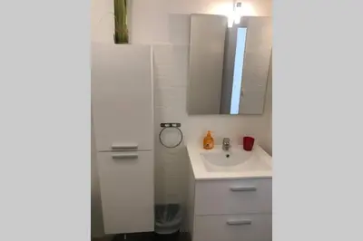 a bathroom with a sink and a mirror at studio centre nice proche de mer in Nice