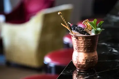 a copper cup filled with food on top of a table at Hotel Royal-Riviera in Saint-Jean-Cap-Ferrat